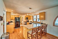 Big Green Getaway with Lake Views and Large Deck Tourism House